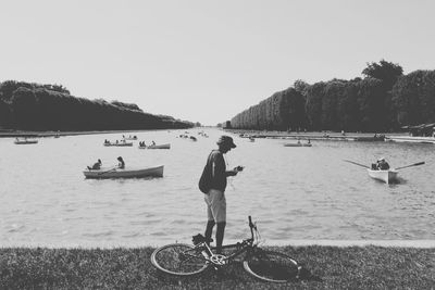 People at versailles palace in paris france in black and white retro colours