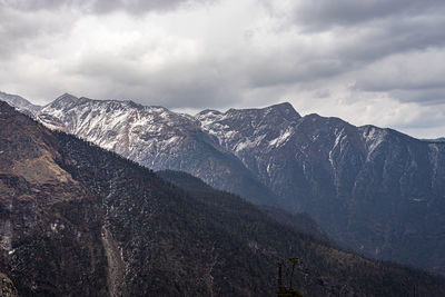 Himalayan mountains covered with light snow at evening