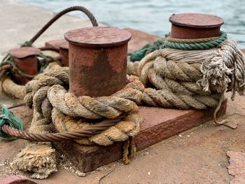 Close-up of rope tied to bollard