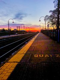 View of railroad tracks at sunset