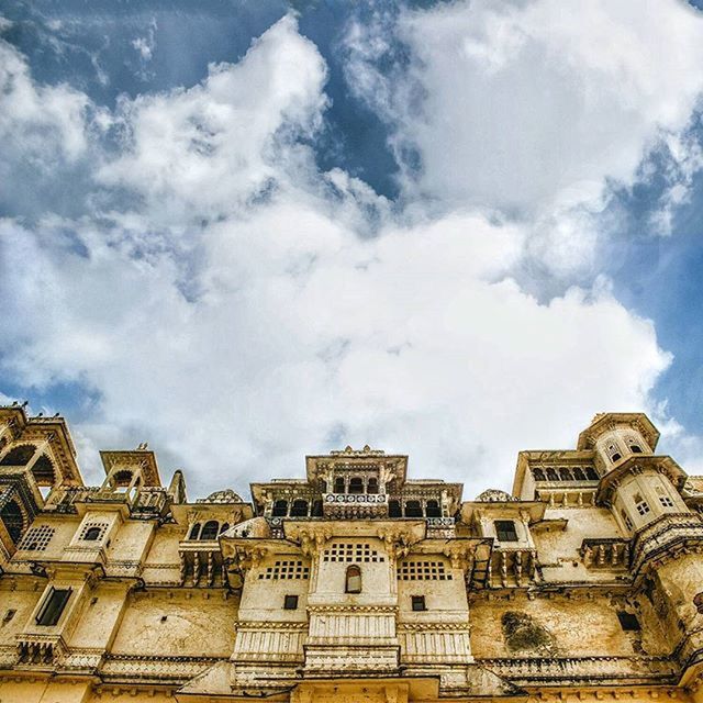 architecture, building exterior, built structure, low angle view, sky, cloud - sky, city, building, cloudy, cloud, day, window, history, outdoors, residential building, no people, travel destinations, residential structure, capital cities, architectural feature