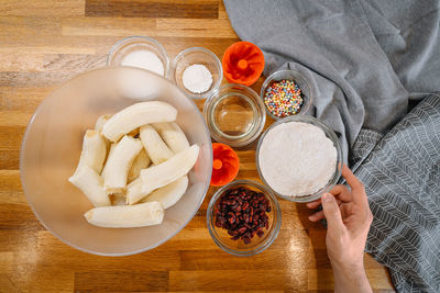 High angle view person cooking banana bread ingredients on table