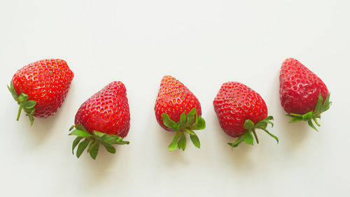 Close-up of strawberries against white background