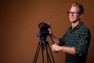 Portrait of man photographing