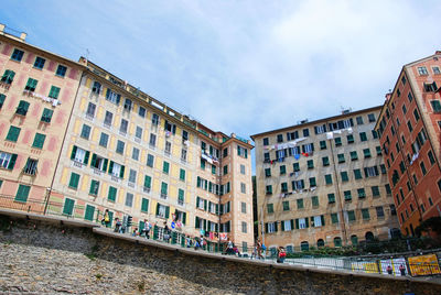 Buildings in city against sky