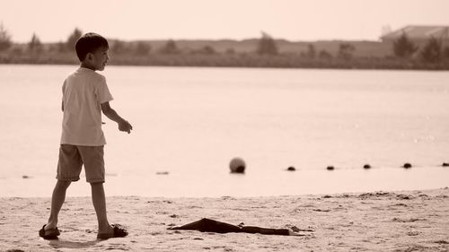 Full length of woman standing on beach