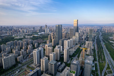 Aerial view of cityscape against sky