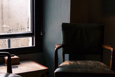 Man sitting on chair at home