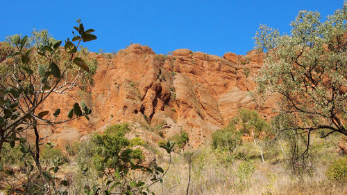 Scenic view of mountains against clear blue sky