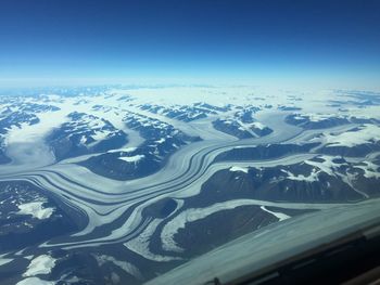 Aerial view of snow covered mountains