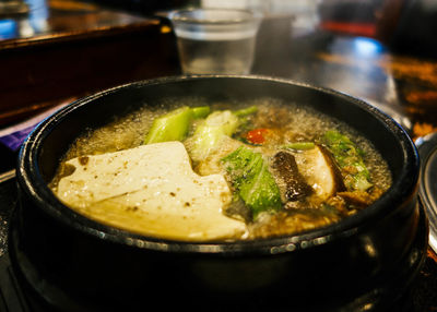 Close-up of soup cooking on stove in kitchen