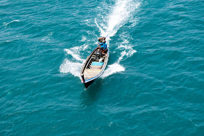 High angle view of man in boat on sea