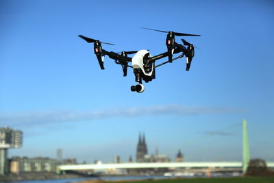 Low angle view of drone against clear sky