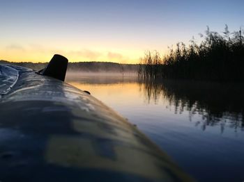 Scenic view of calm lake at sunset