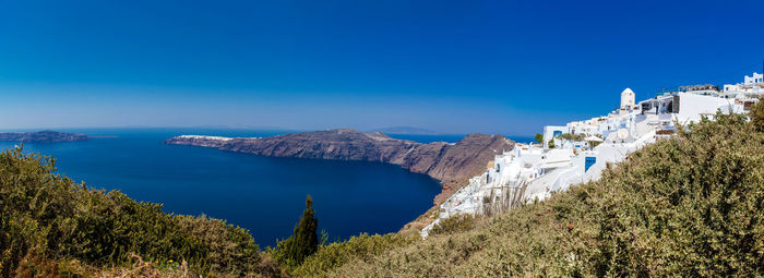 View of imerovigli village, the aegean sea and oia city from the walking trail  between fira and oia