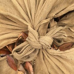 High angle view of person tied up on bed