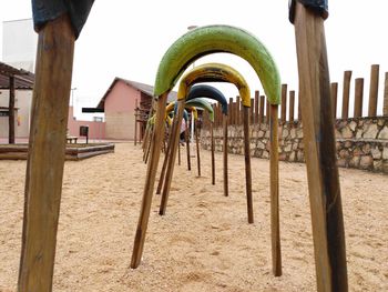 Playground in park against clear sky