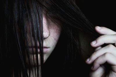 Close-up portrait of woman with black hair