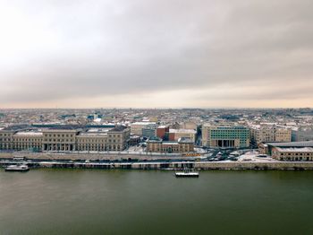 High angle view of river amidst buildings in city