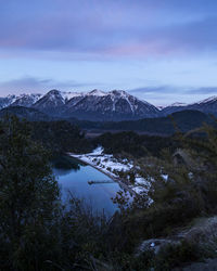 Scenic view of snowcapped mountains against sky during winter