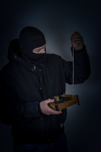 Man wearing mask against white background