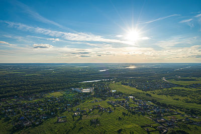 Scenic view of landscape and buildings against sky