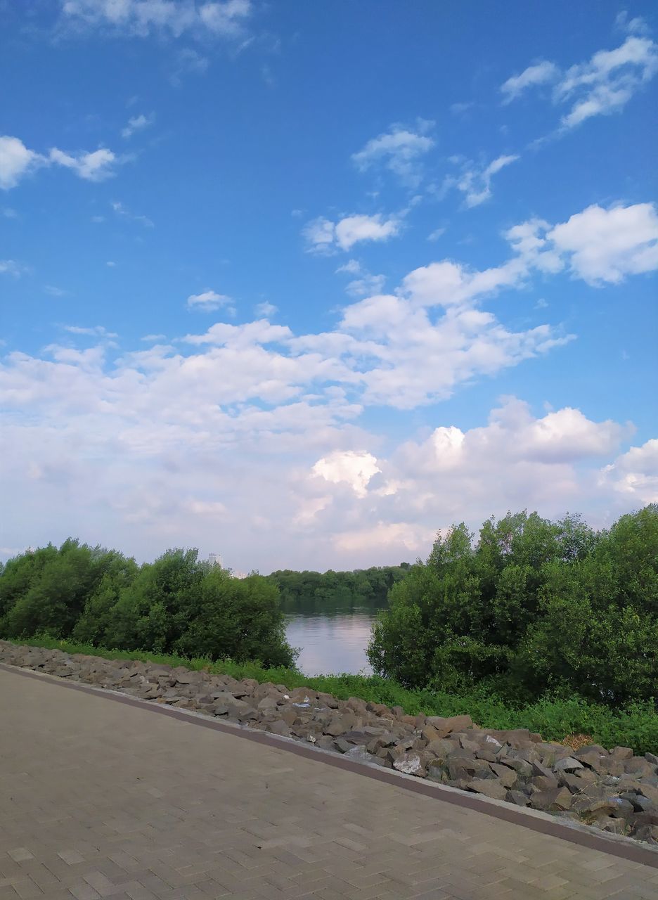 sky, cloud, tree, plant, nature, road, no people, transportation, day, environment, landscape, blue, beauty in nature, scenics - nature, outdoors, water, land, tranquility, travel, footpath, city, street, green