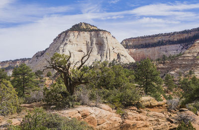 Rock formations on landscape against sky