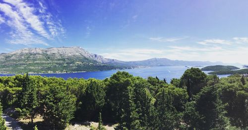 Scenic view of lake against cloudy sky