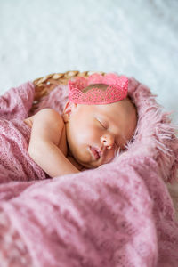 Cute baby sleeping in crib at home