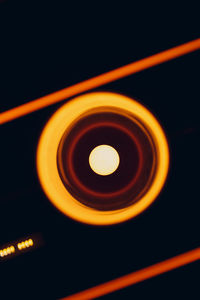 Close-up of illuminated light against black background