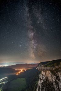 Scenic view of mountain against sky at night