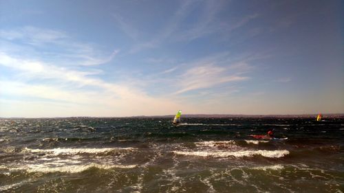 View of calm sea against cloudy sky