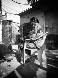 Man sitting in old building