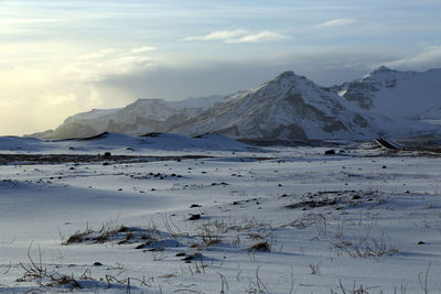 Scenic view of snowcapped mountains against sky