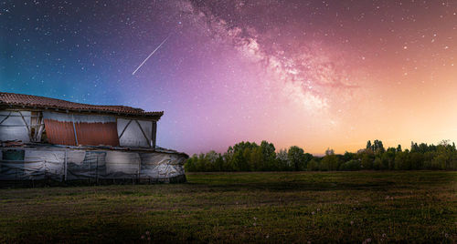 Scenic view of field against sky at night