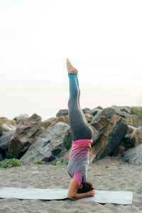 Woman exercising at beach