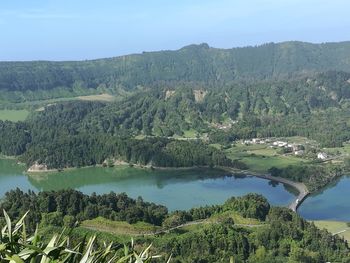 Scenic view of lake and mountains against sky