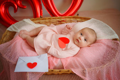 Valentine's day, little girl with valentine envelope