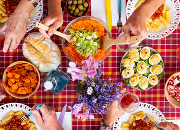 High angle view of people holding food