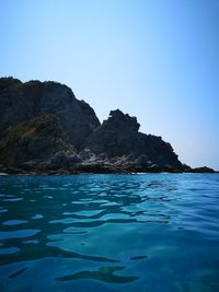 Scenic view of sea against clear blue sky