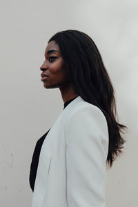 Woman standing against white background