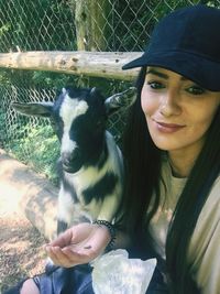 Portrait of young woman with horse