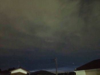 Low angle view of storm clouds at night