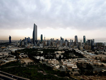 Aerial view of modern buildings in city against sky