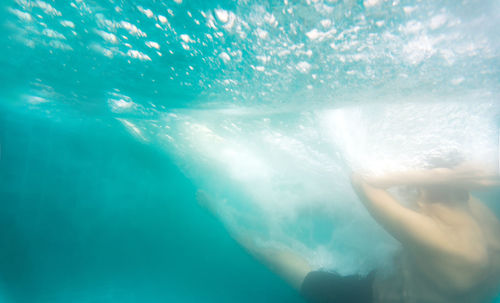 Woman swimming in sea