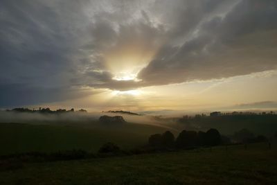 Scenic view of landscape against sky during sunset