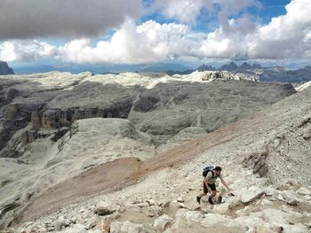 Scenic view of mountains against cloudy sky