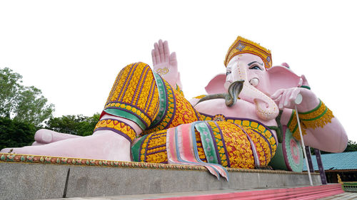 Low angle view of statue against sky