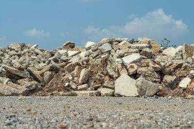 Low angle view of rocks against sky